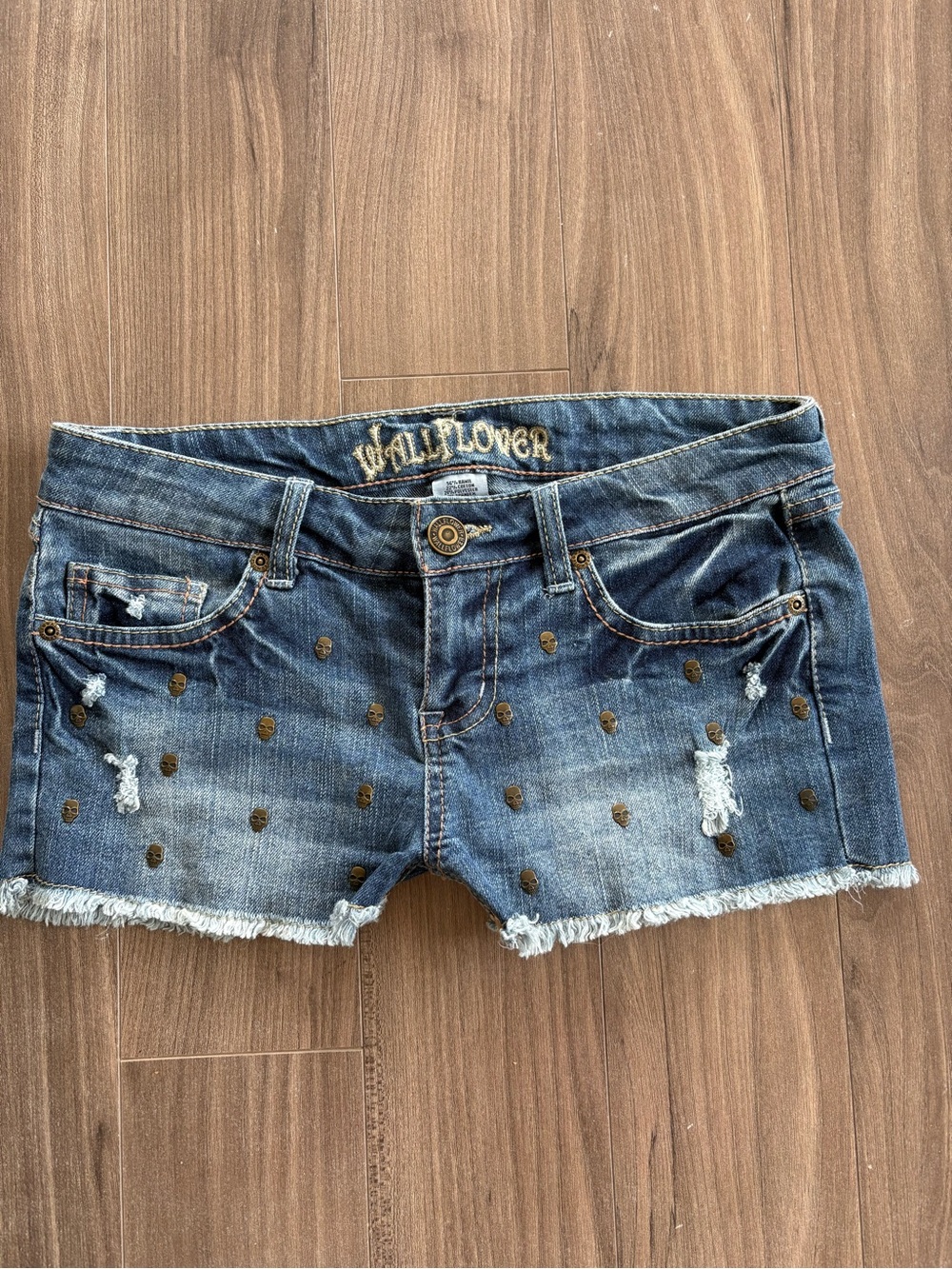 Wallflower Low Rise Mini Distressed Denim Shorts with Stud Detail